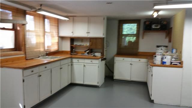 9035 Alex Goins Road Lyles, TN 37098 - Photo 19 of 20 Full size work room in basement. With a little work, the basement has potential to be an apartment with it's own bath and kitchen.