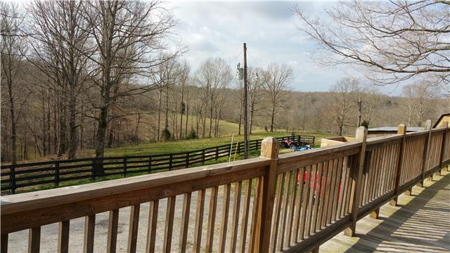 9035 Alex Goins Road Lyles, TN 37098 - Photo 7 of 20 Deck around the house to enjoy a beautiful view. The deck provides a covered patio for the area below.