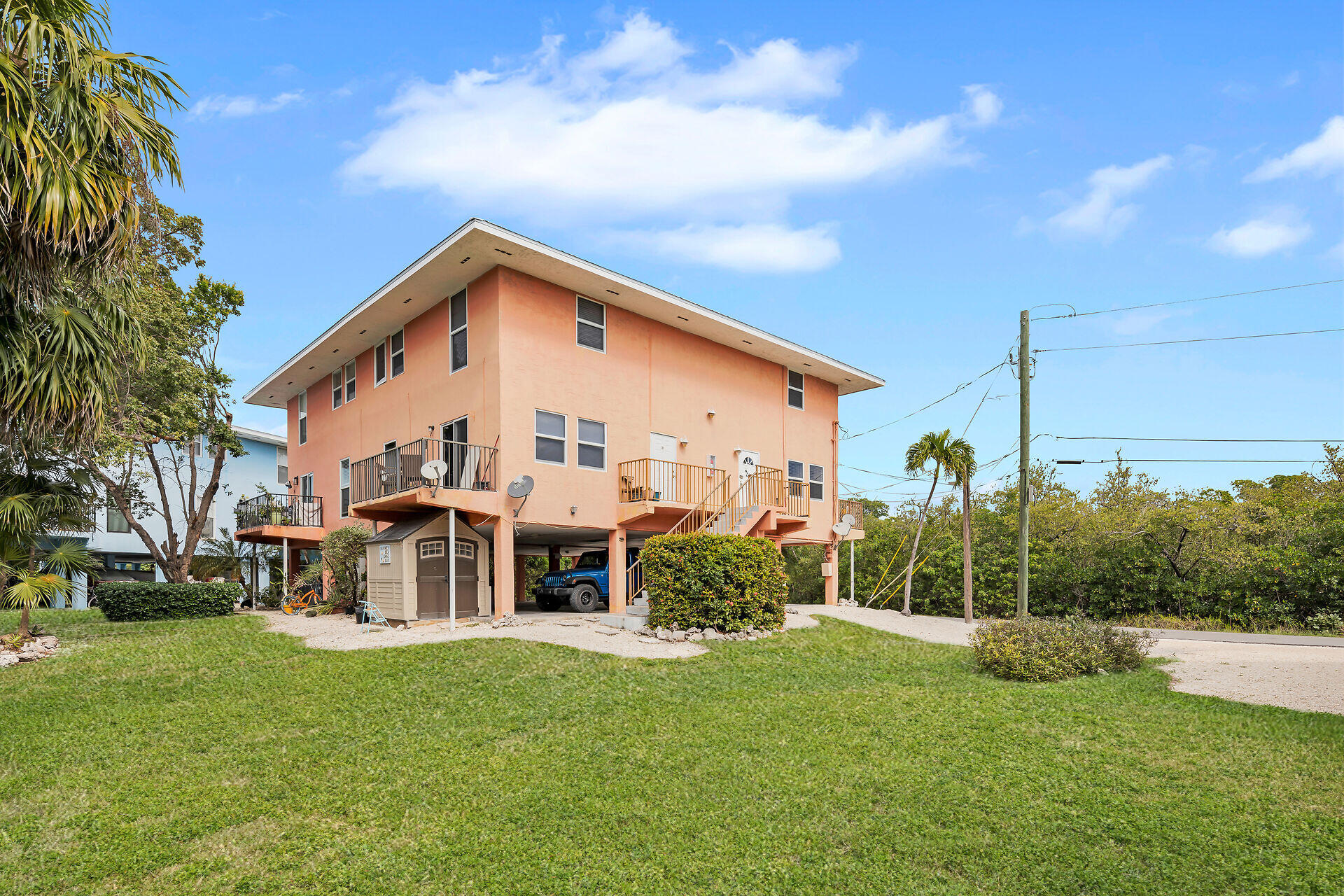 111 Stirrup Key Woods Road, Unit 2B1 Marathon, FL 33050 - Photo 30 of 36 a view of a house with backyard and a tree