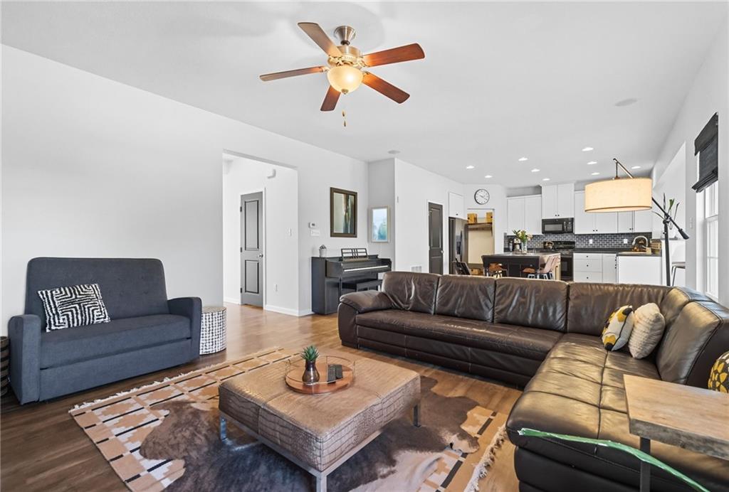 347 Ranchero Drive Coraopolis, PA 15108 - Photo 11 of 46 a living room with furniture a rug and a chandelier