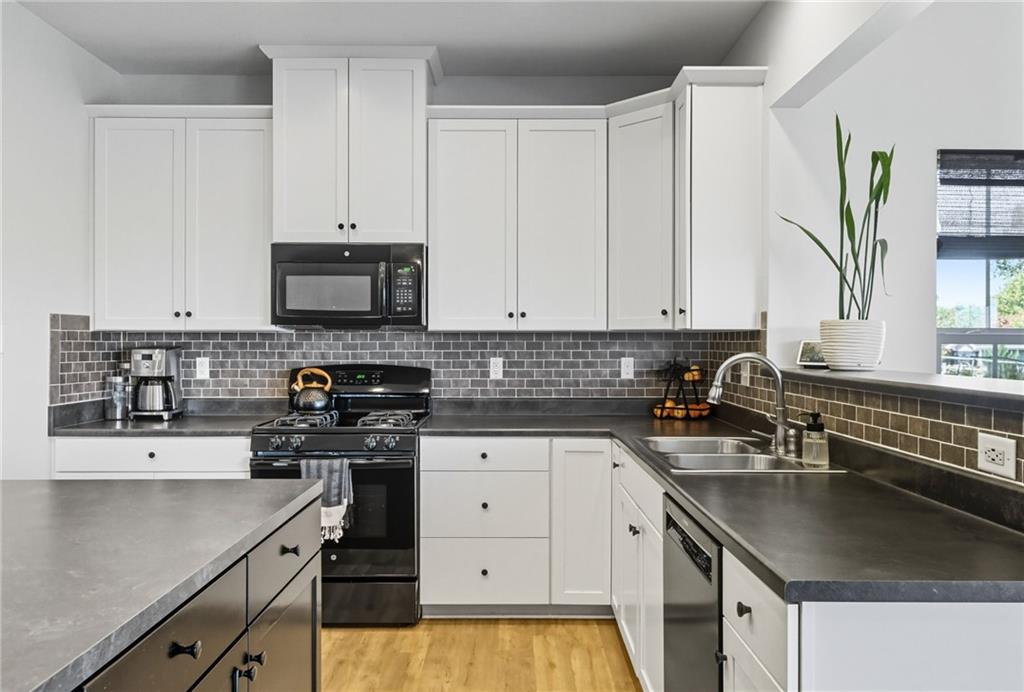 347 Ranchero Drive Coraopolis, PA 15108 - Photo 15 of 46 a kitchen with granite countertop a sink a stove and cabinets