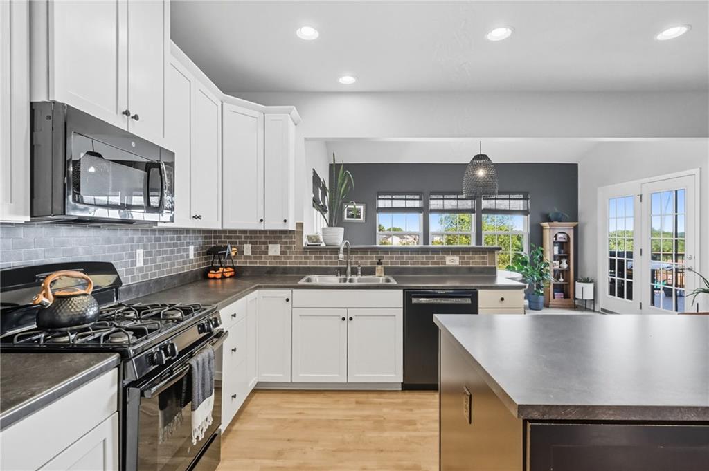 347 Ranchero Drive Coraopolis, PA 15108 - Photo 16 of 46 a kitchen with a stove sink and microwave