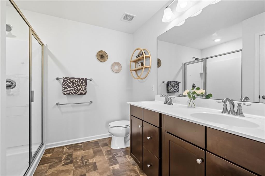 347 Ranchero Drive Coraopolis, PA 15108 - Photo 23 of 46 a bathroom with a sink a toilet a mirror and vanity