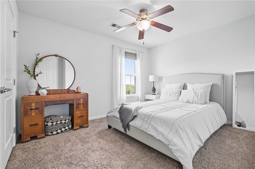 347 Ranchero Drive Coraopolis, PA 15108 - Photo 28 of 46 a bedroom with a bed a fireplace and a chandelier