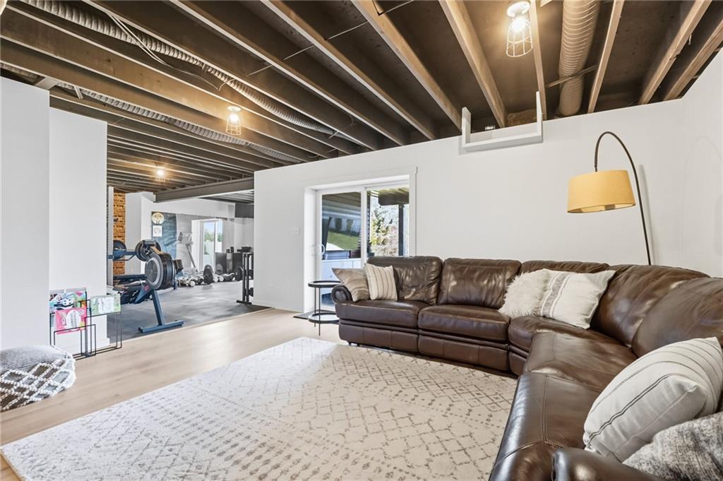 347 Ranchero Drive Coraopolis, PA 15108 - Photo 32 of 46 a living room with furniture and a chandelier