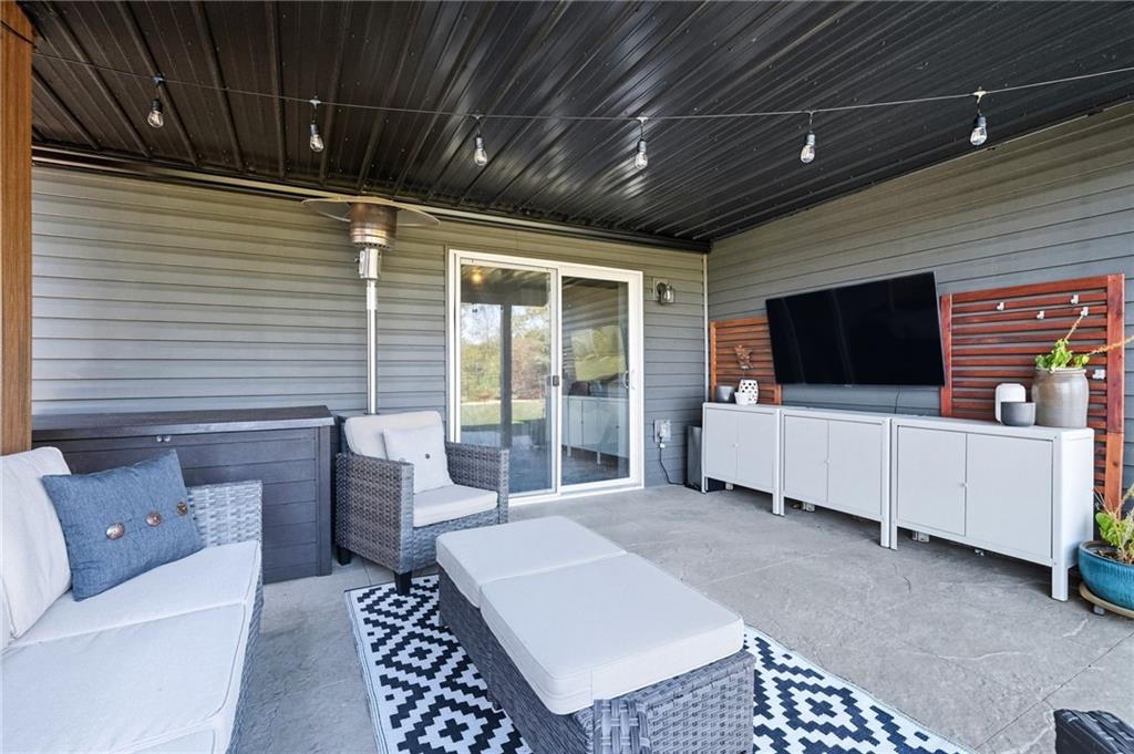 347 Ranchero Drive Coraopolis, PA 15108 - Photo 39 of 46 a living room with furniture a flat screen tv and a table