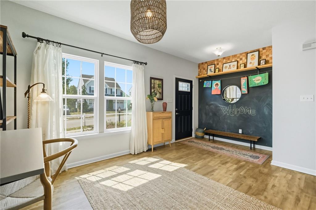 347 Ranchero Drive Coraopolis, PA 15108 - Photo 8 of 46 a view of an entryway with wooden floor and a window