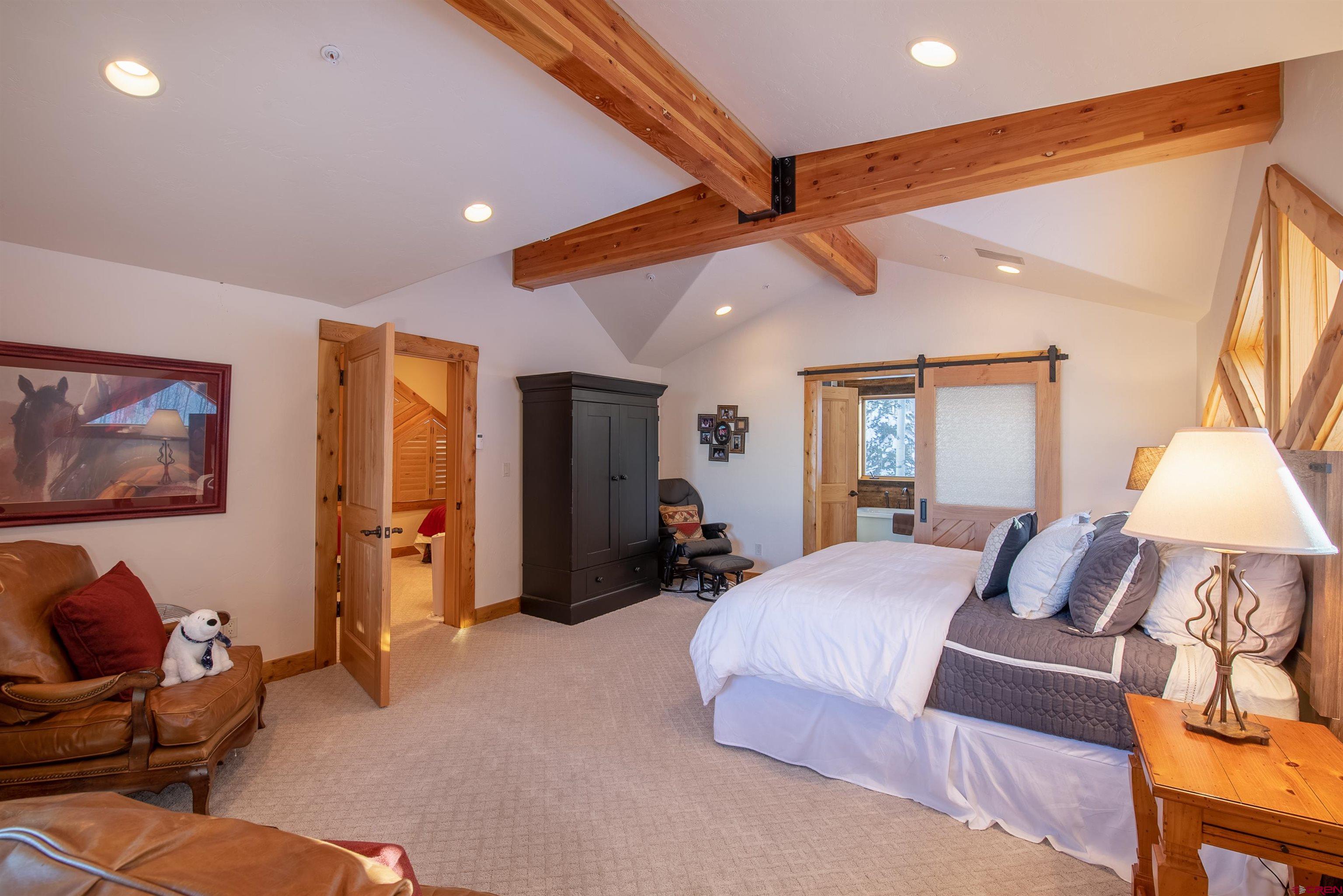 1894 Red Mountain Ranch Road Crested Butte, CO 81224 - Photo 13 of 34 a bedroom with a bed and furniture