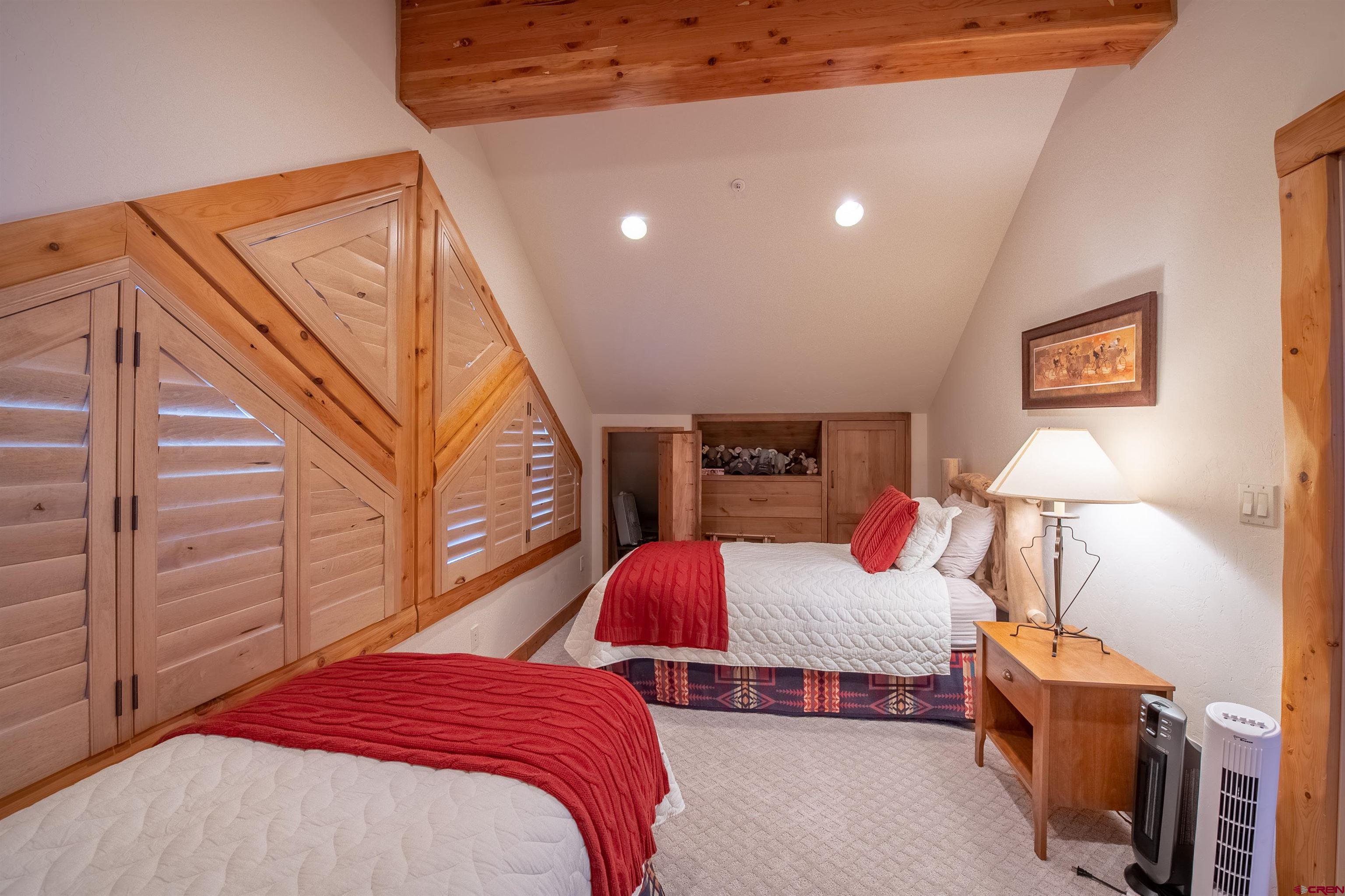 1894 Red Mountain Ranch Road Crested Butte, CO 81224 - Photo 14 of 34 a bedroom with a bed and a lamp