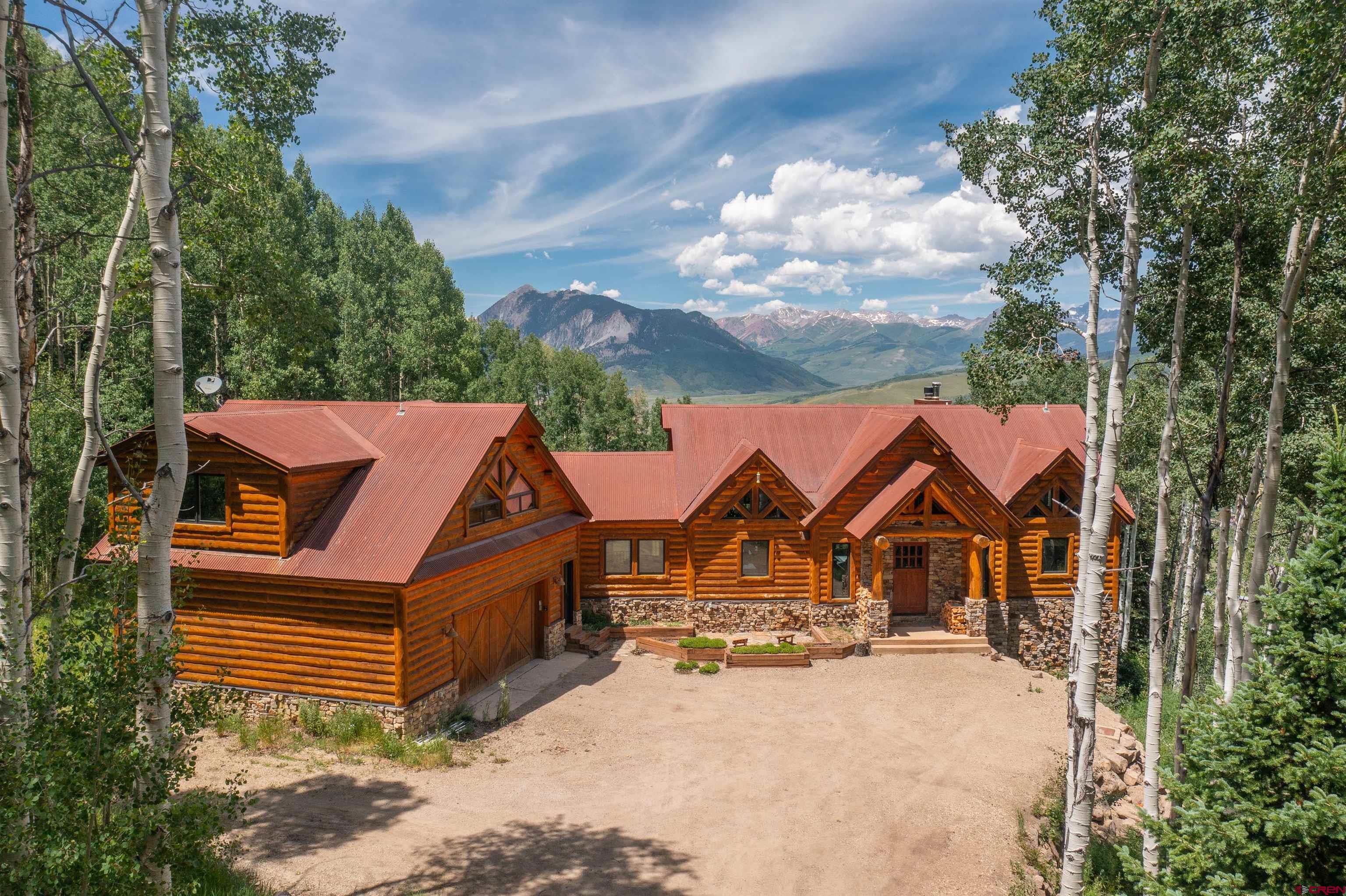 1894 Red Mountain Ranch Road Crested Butte, CO 81224 - Photo 2 of 34 a view of multiple houses with a yard