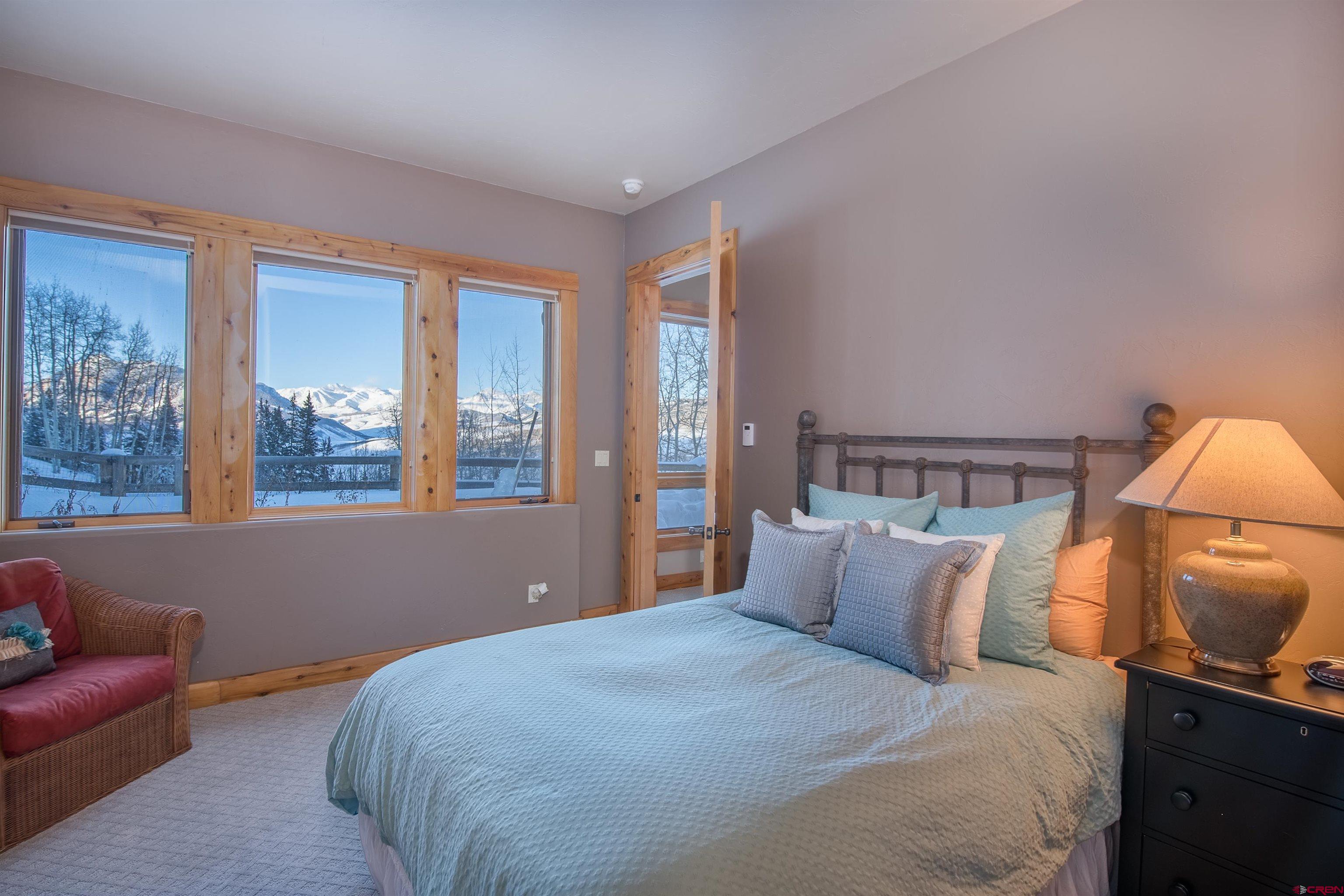 1894 Red Mountain Ranch Road Crested Butte, CO 81224 - Photo 22 of 34 a bedroom with bed and window