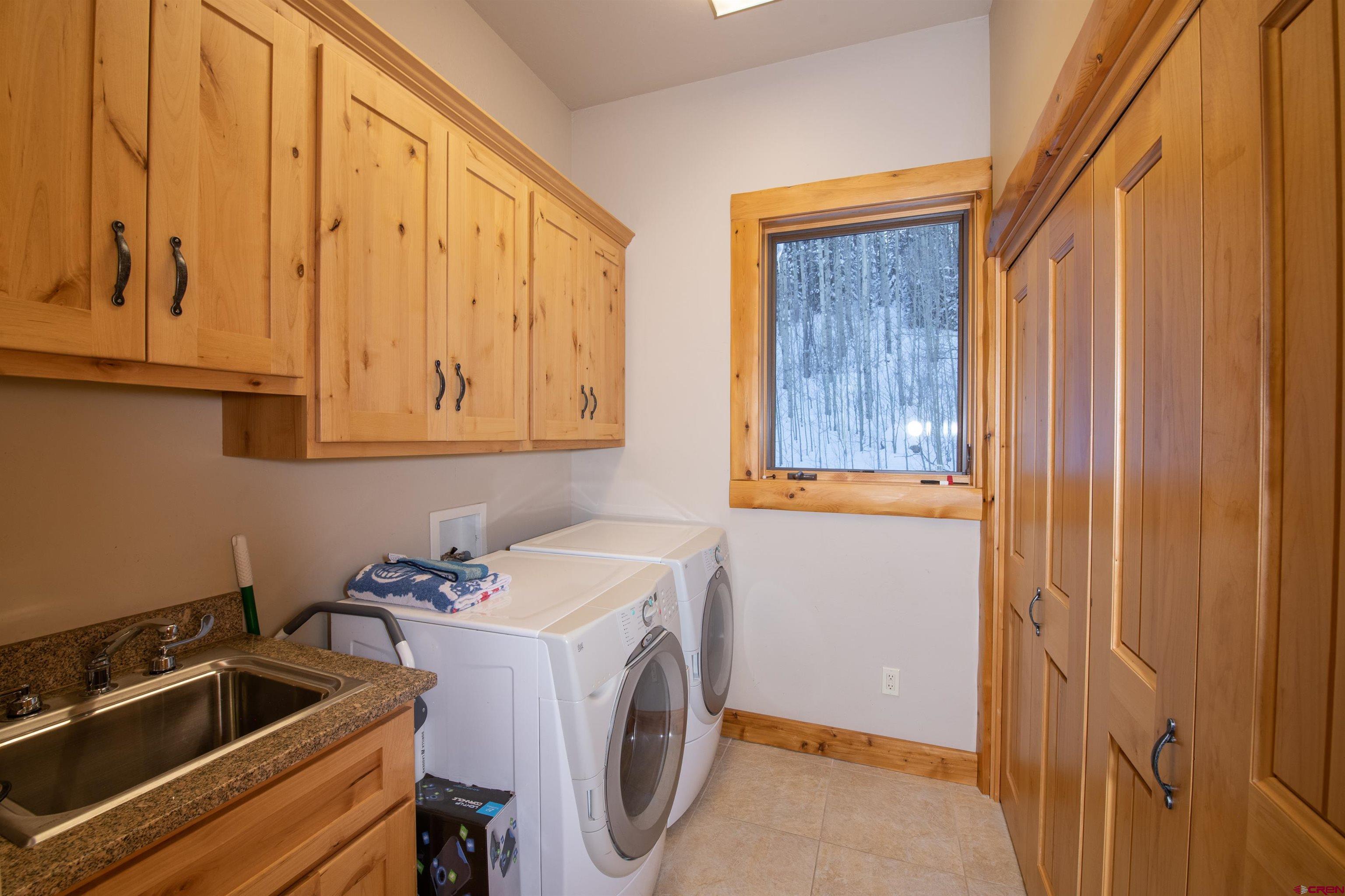 1894 Red Mountain Ranch Road Crested Butte, CO 81224 - Photo 30 of 34 a utility room with dryer and washer