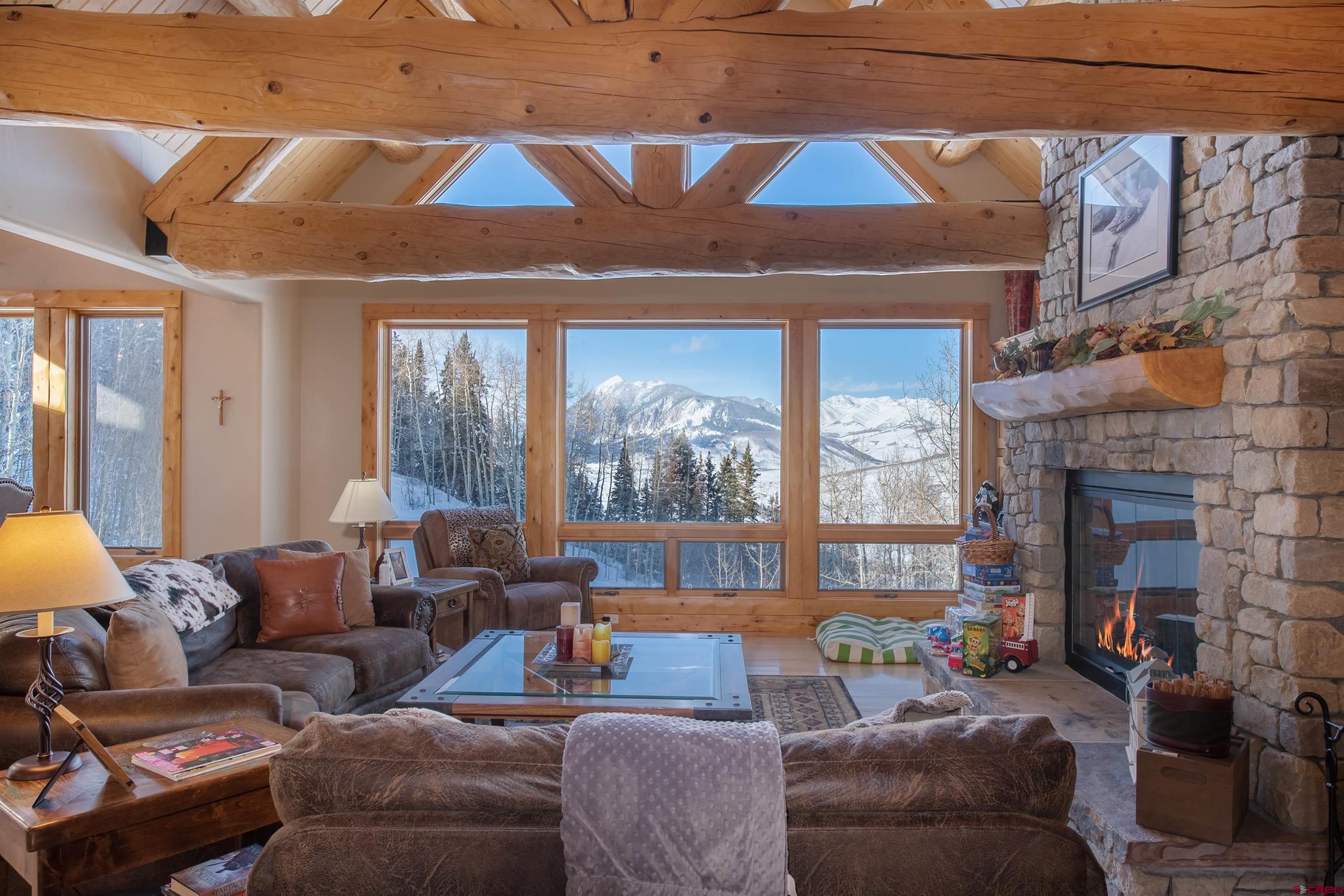 1894 Red Mountain Ranch Road Crested Butte, CO 81224 - Photo 4 of 34 a living room with furniture and a fireplace