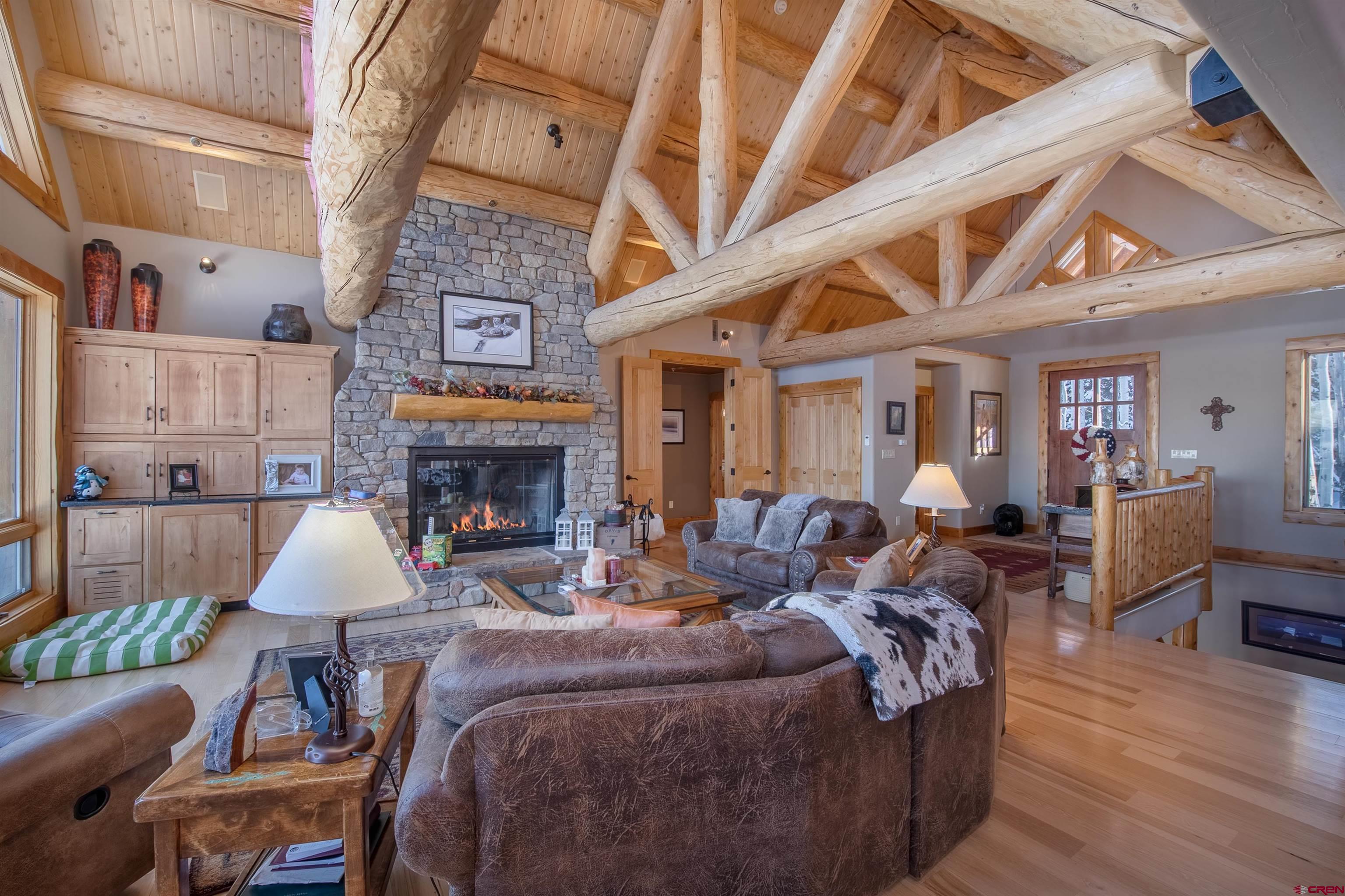 1894 Red Mountain Ranch Road Crested Butte, CO 81224 - Photo 5 of 34 a living room with furniture and a fireplace