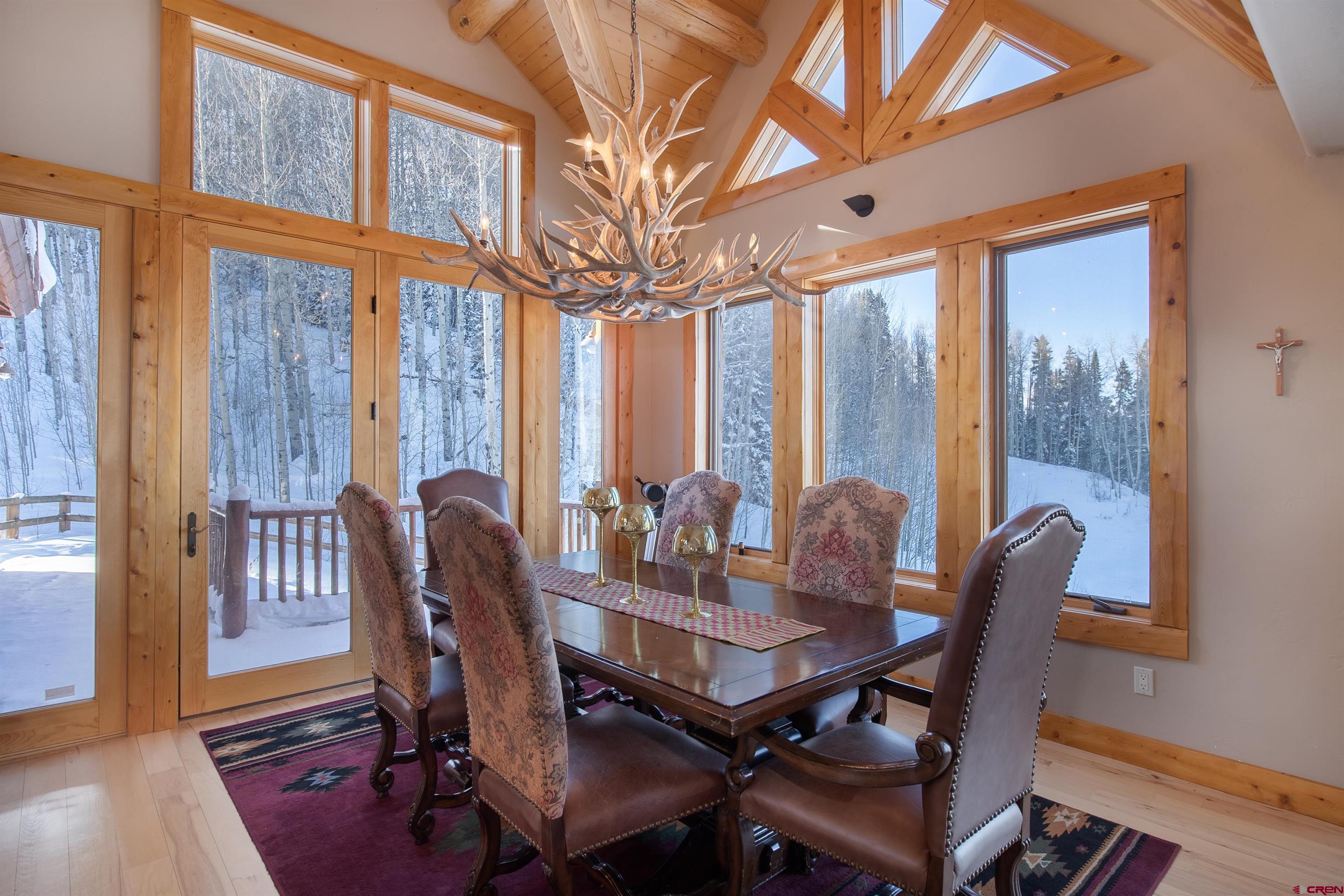 1894 Red Mountain Ranch Road Crested Butte, CO 81224 - Photo 6 of 34 a view of a dining room with furniture window and wooden floor