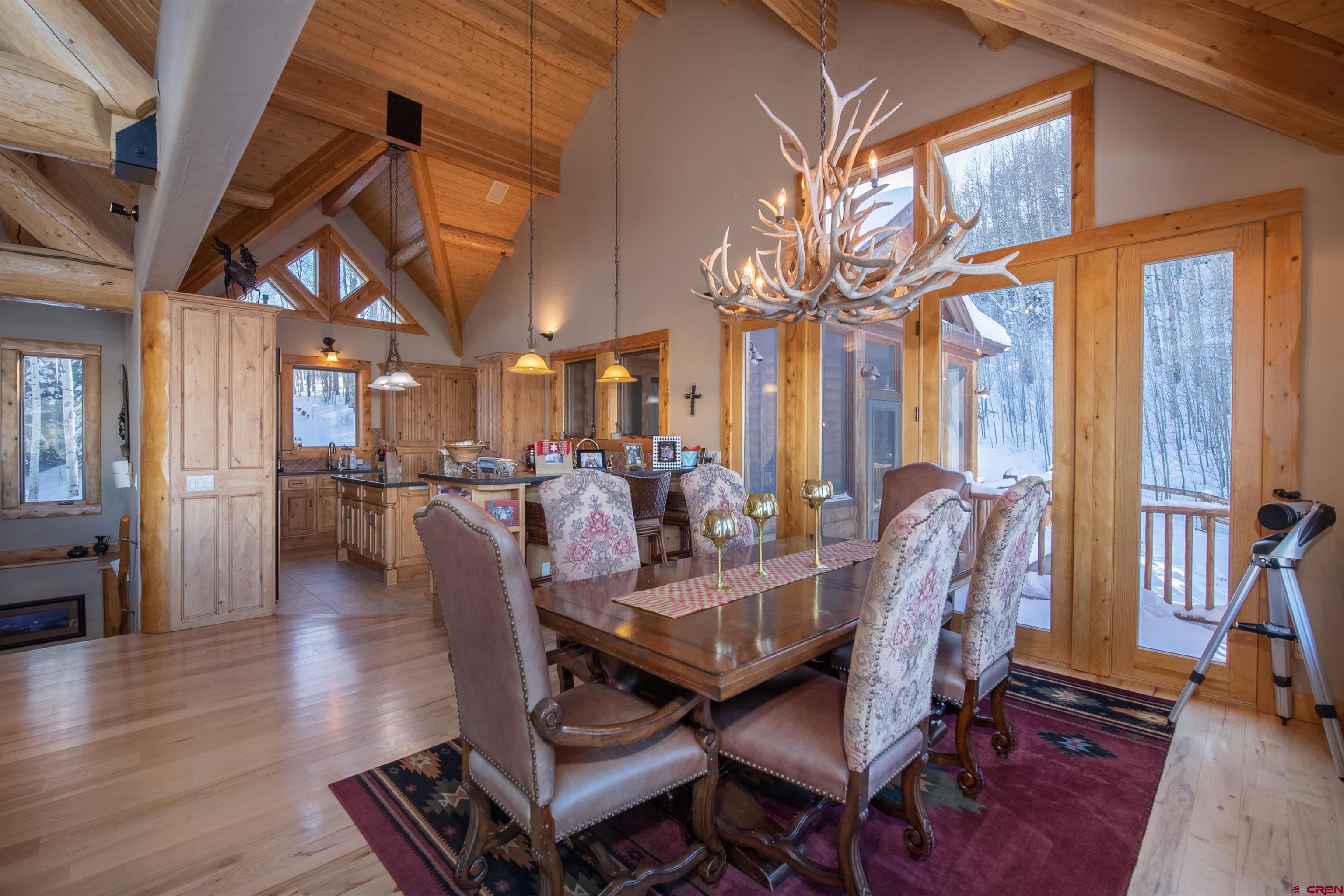1894 Red Mountain Ranch Road Crested Butte, CO 81224 - Photo 7 of 34 a view of a dining room with furniture window and wooden floor