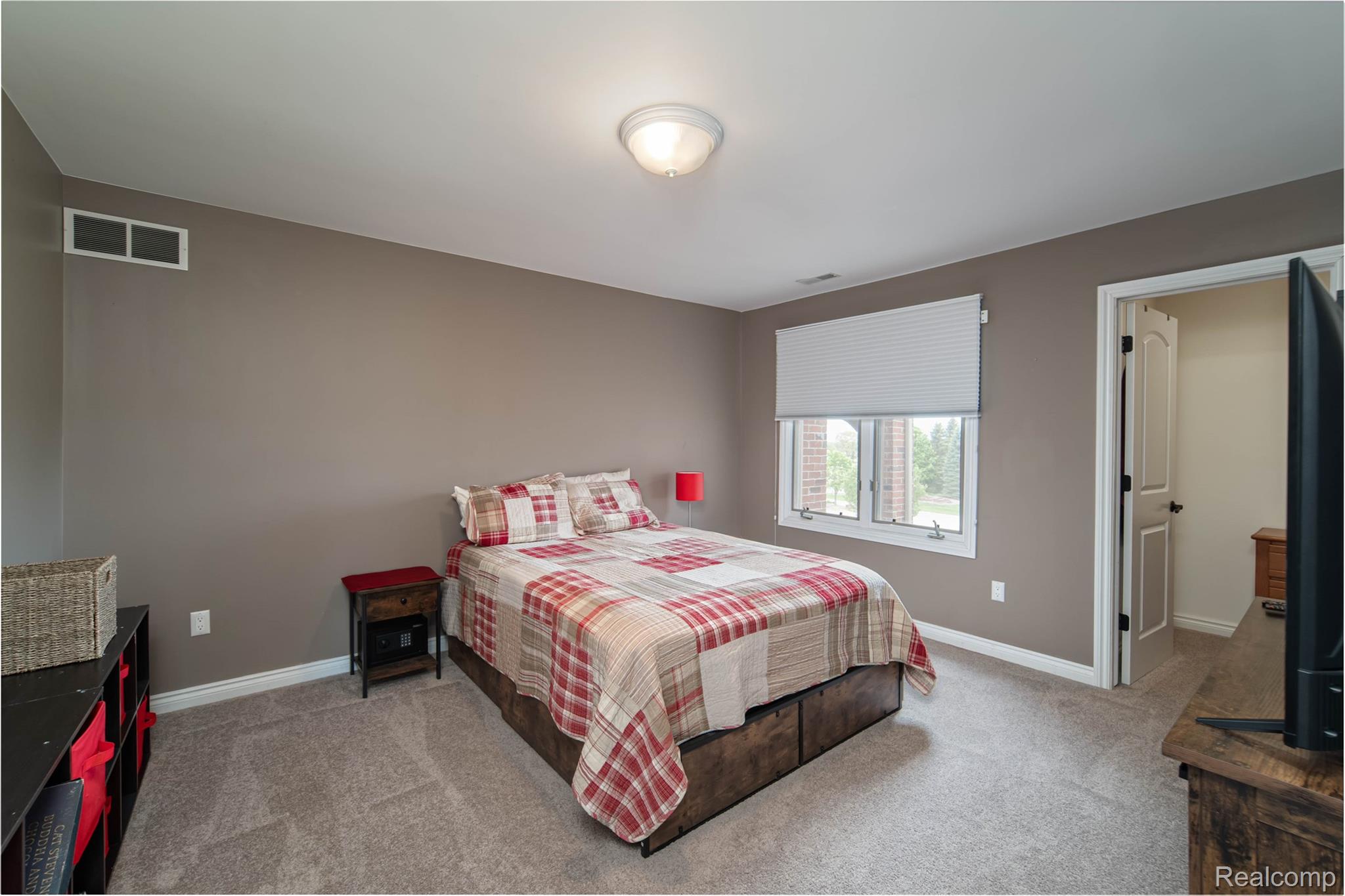 67102 Rachael Lane Washington, MI 48095 - Photo 34 of 37 Bedroom with light carpet and baseboards