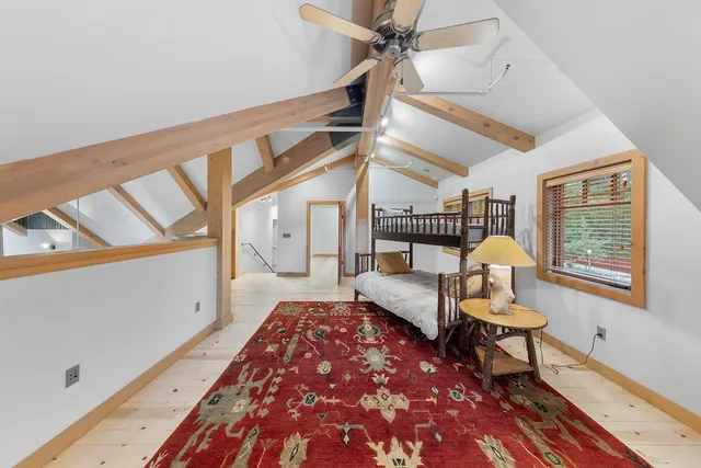 a bedroom with bed and window