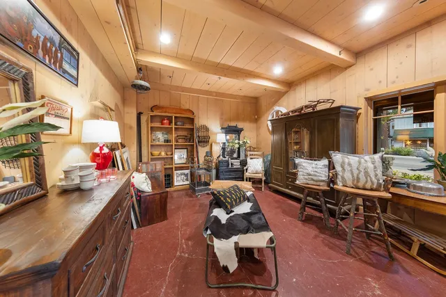 a room with lots of furniture and a flat screen tv