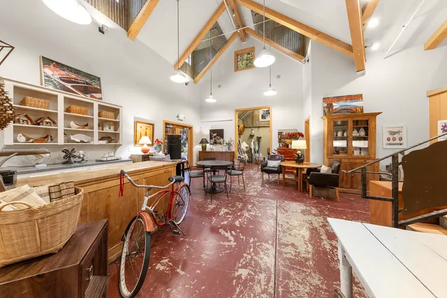 a view of a living room and kitchen