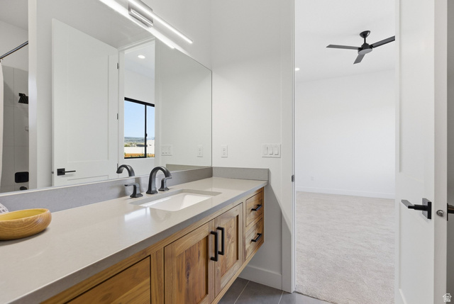 2197 Reserve Circle St. George, UT 84770 - Photo 41 of 57 Bathroom featuring vanity, dark carpet, ceiling fan, and recessed lighting