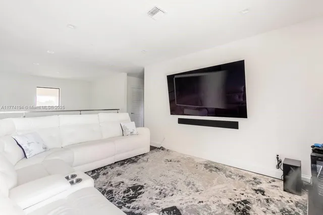 a living room with a couch and a flat screen tv