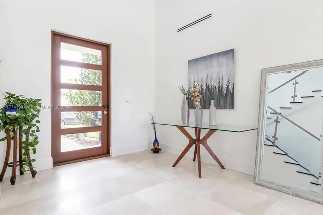 a view of an chairs and tables in a room