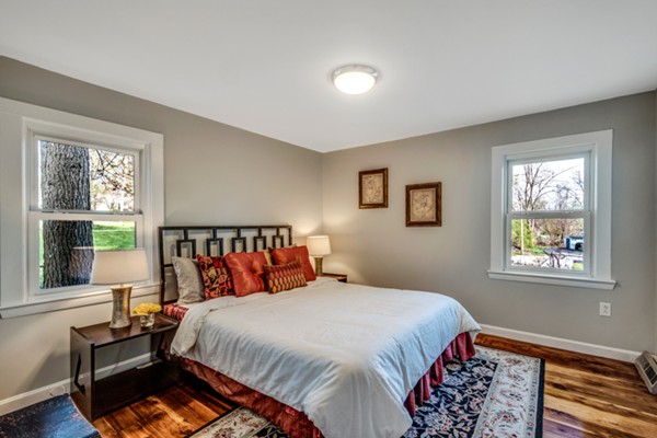 36 Whalom Road Lunenburg, MA 01462 - Photo 19 of 26 a bed sitting in a bedroom next to a window