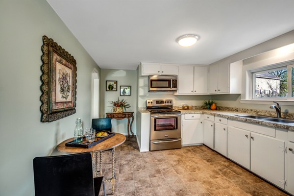 36 Whalom Road Lunenburg, MA 01462 - Photo 9 of 26 a kitchen with granite countertop a sink stove and cabinets