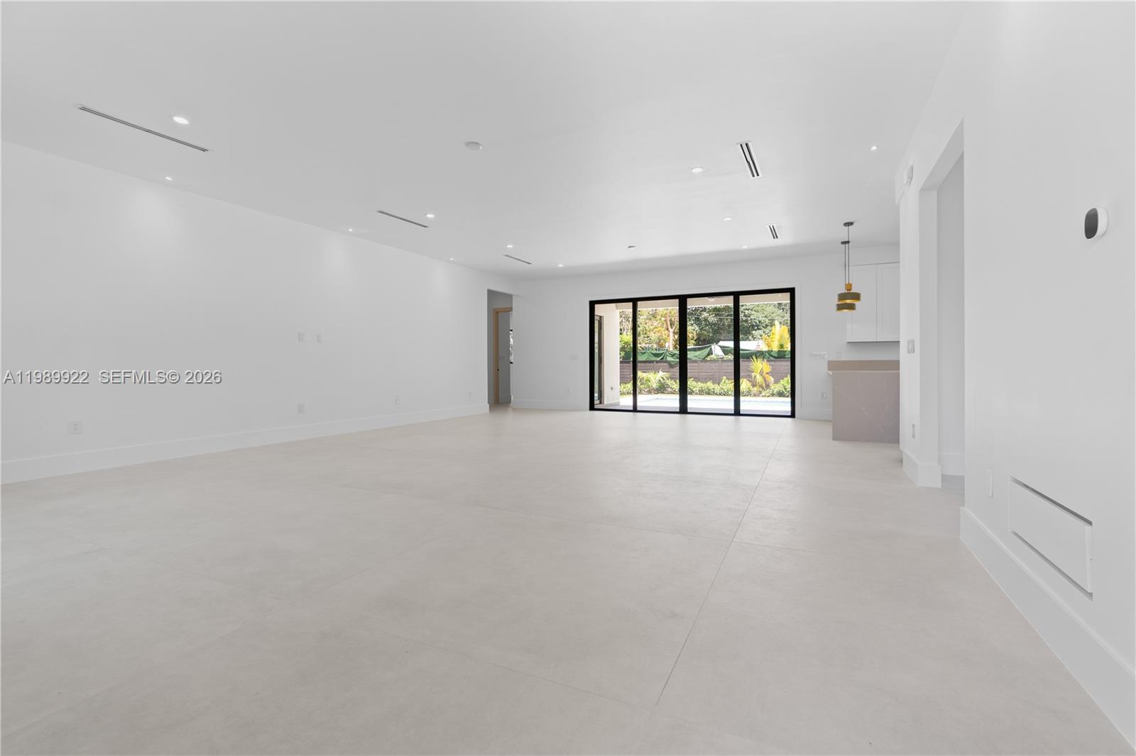6221 Southwest 60th Street South Miami, FL 33143 - Photo 12 of 42 wooden floor in an empty room with a window