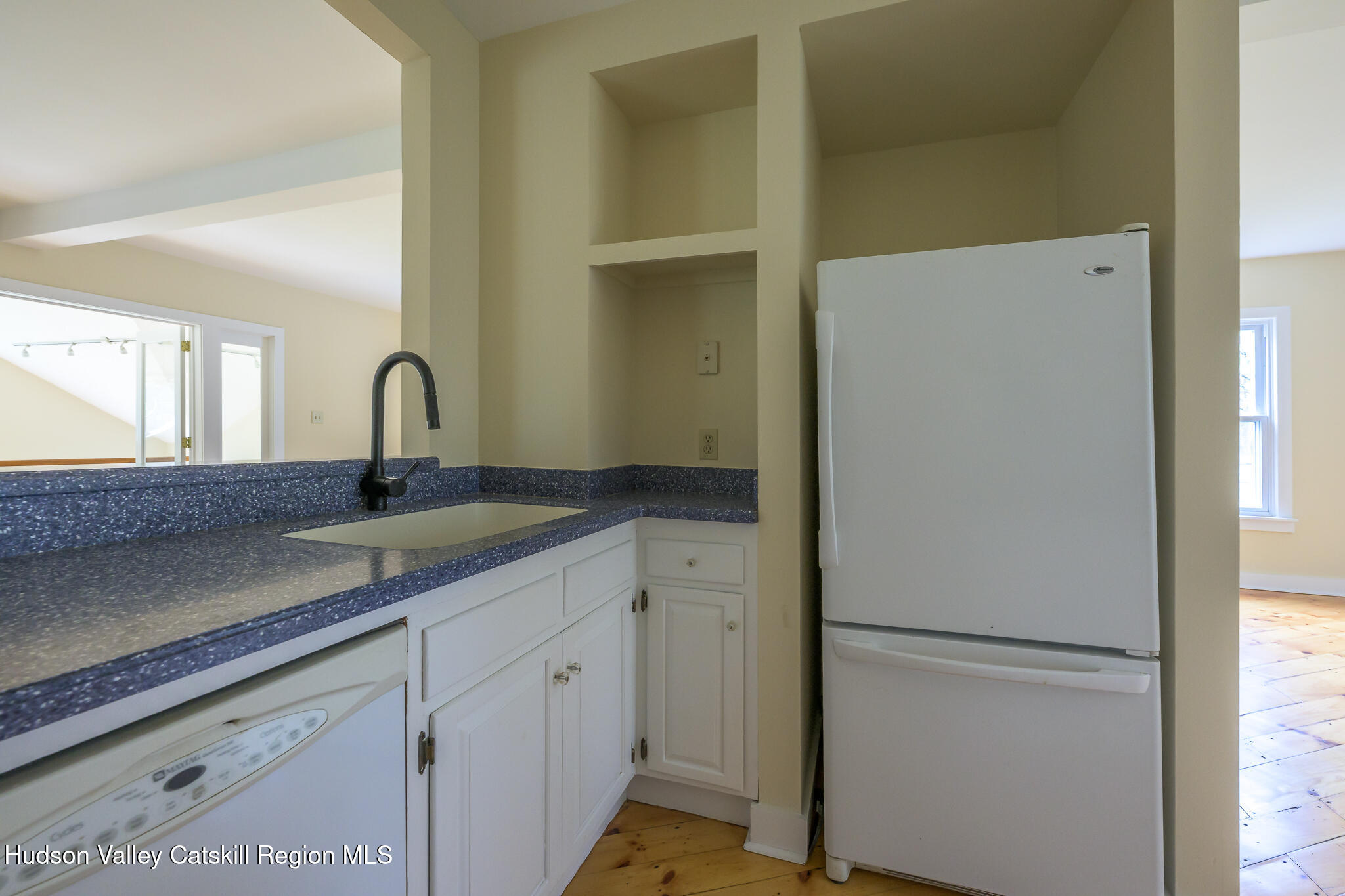477 Fog Hill Road Austerlitz, NY 12017 - Photo 11 of 33 a kitchen with a refrigerator and a sink