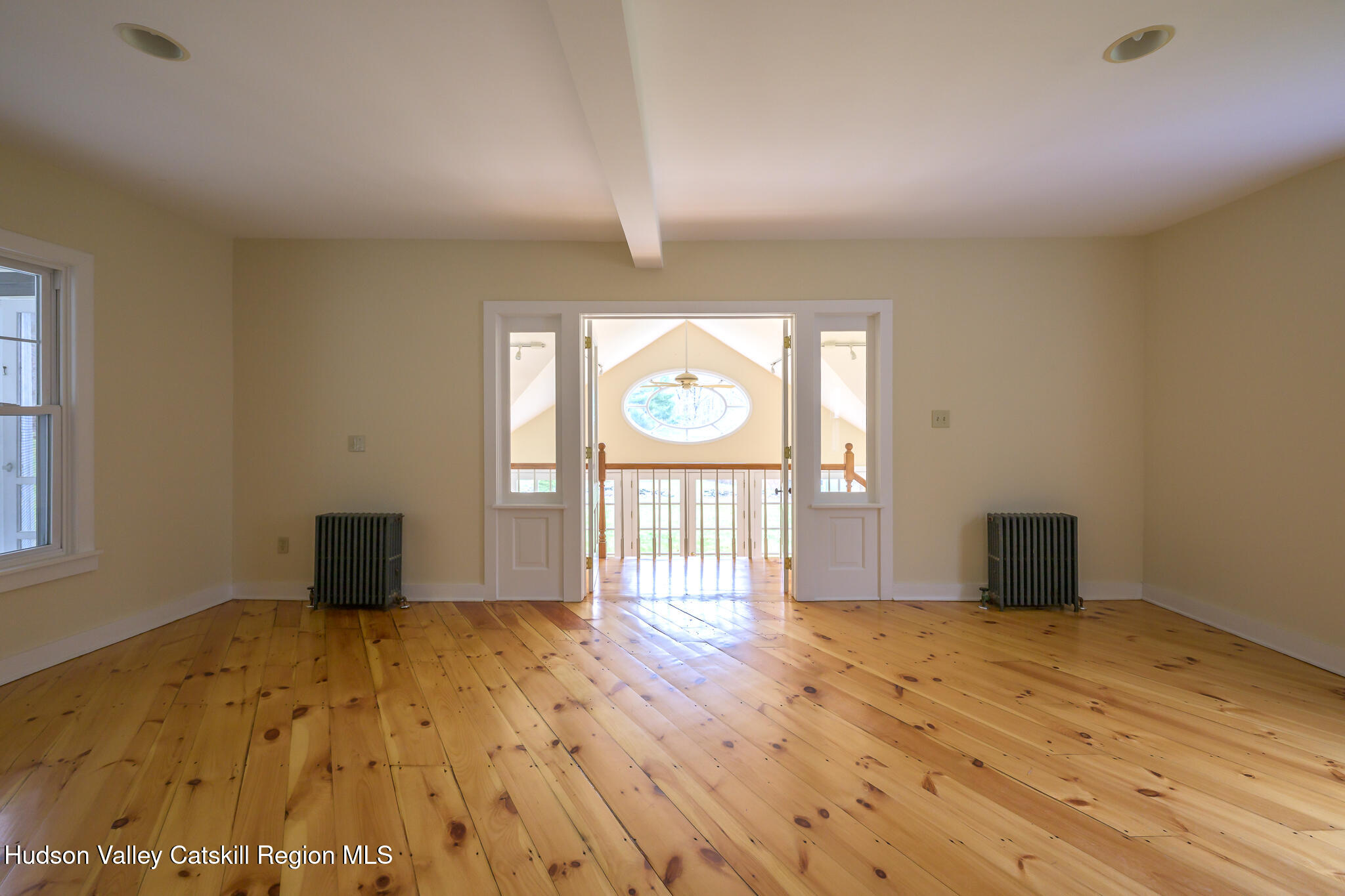477 Fog Hill Road Austerlitz, NY 12017 - Photo 13 of 33 wooden floor in an empty room with a window