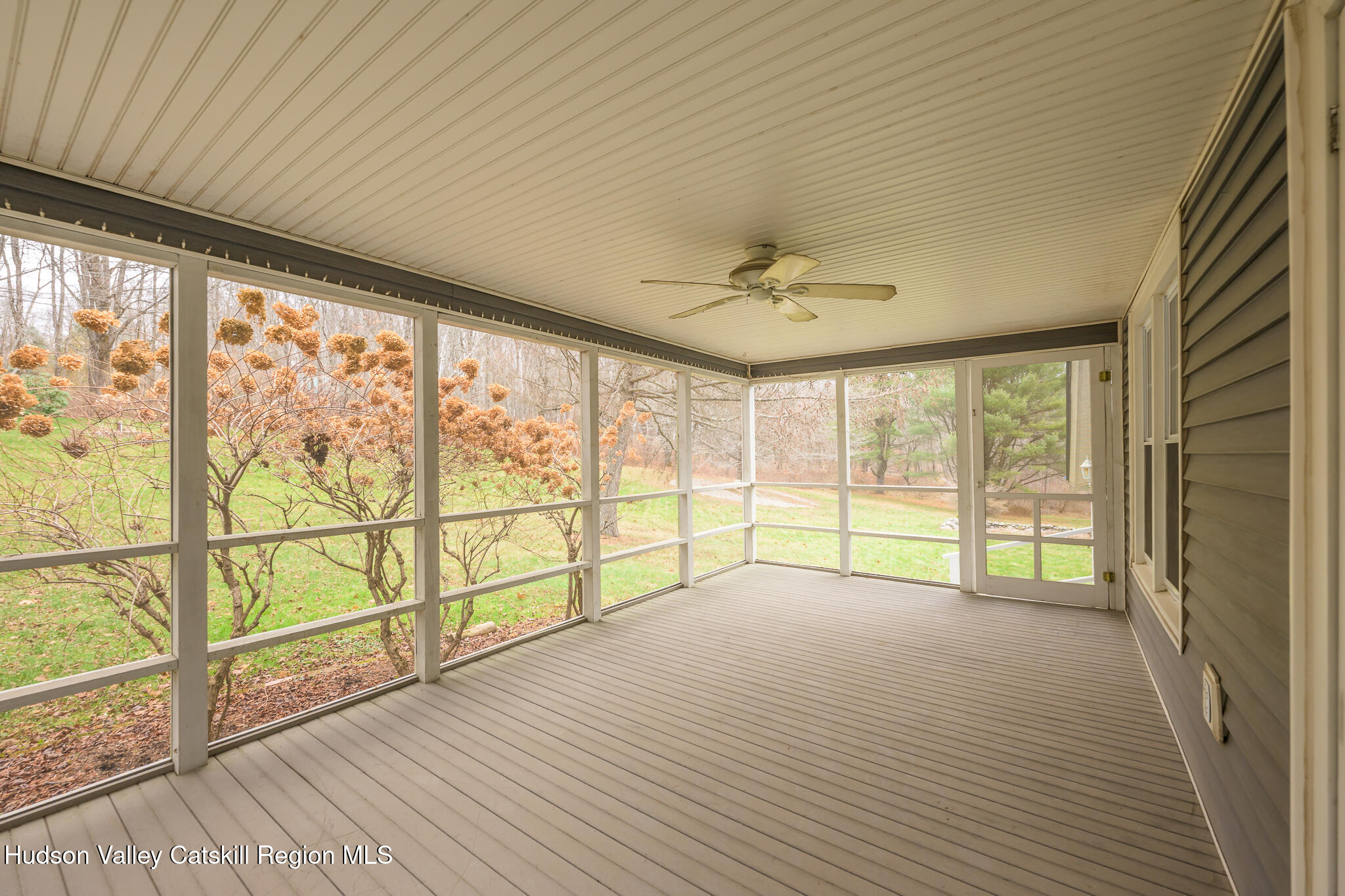 477 Fog Hill Road Austerlitz, NY 12017 - Photo 16 of 33 a view of an empty room with wooden floor and a window
