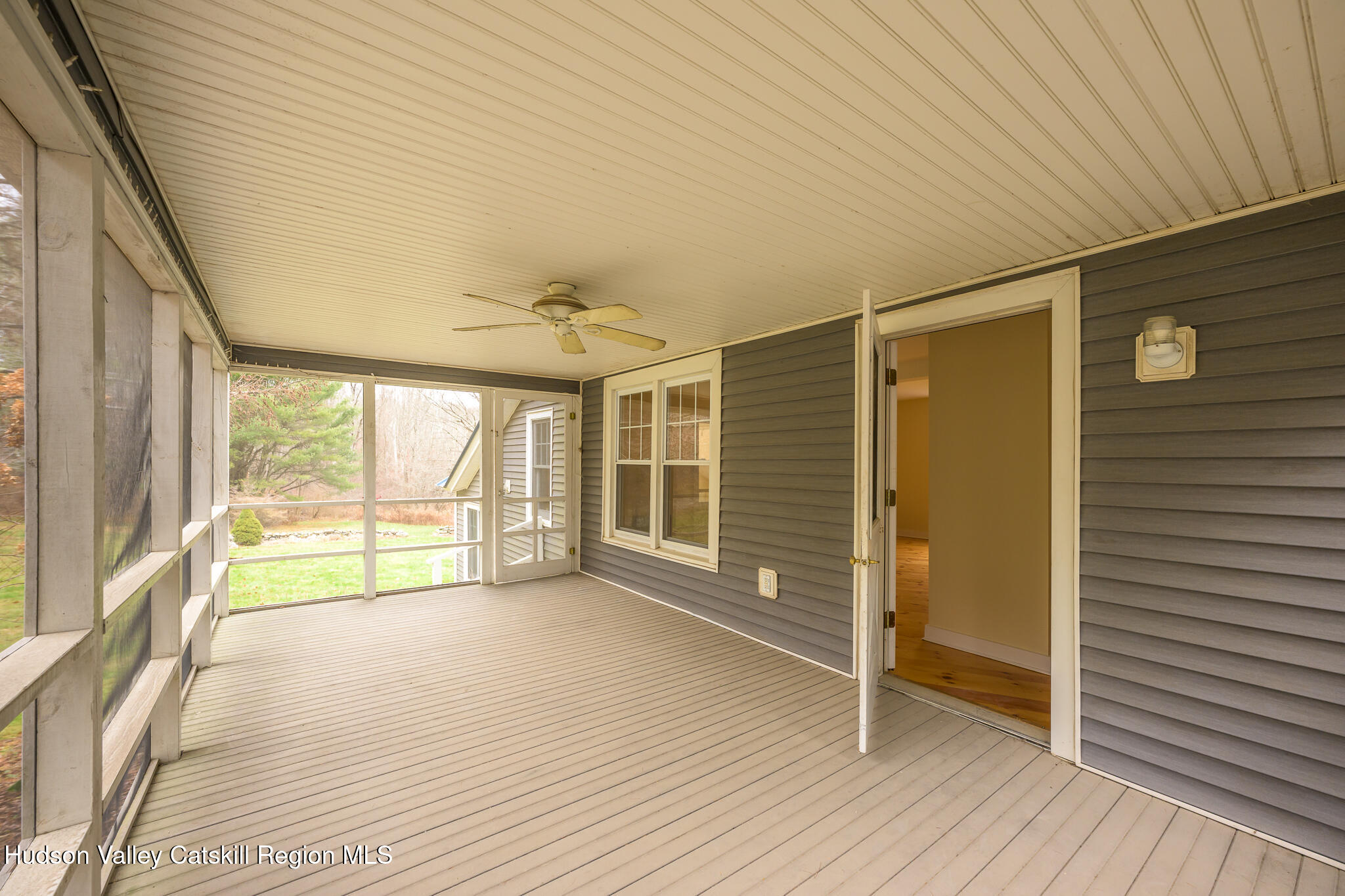 477 Fog Hill Road Austerlitz, NY 12017 - Photo 17 of 33 a view of an empty room with wooden floor and a window