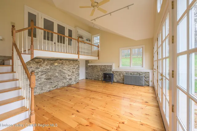 a bathroom with a granite countertop sink a toilet and shower