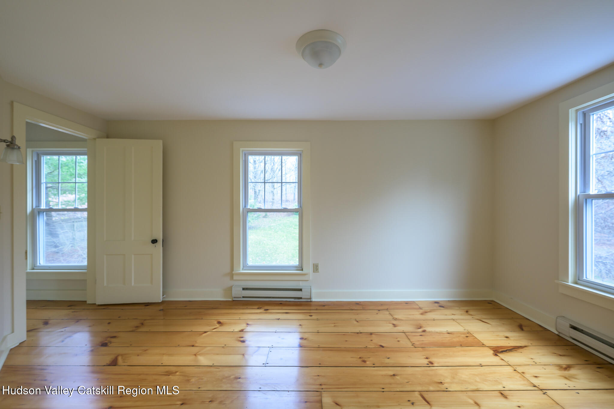 477 Fog Hill Road Austerlitz, NY 12017 - Photo 27 of 33 an empty room with windows