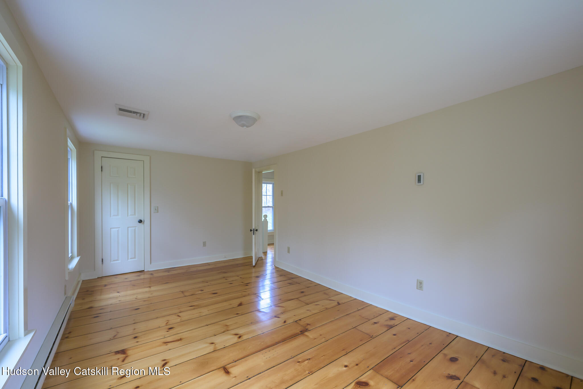 477 Fog Hill Road Austerlitz, NY 12017 - Photo 28 of 33 a view of an empty room and wooden floor