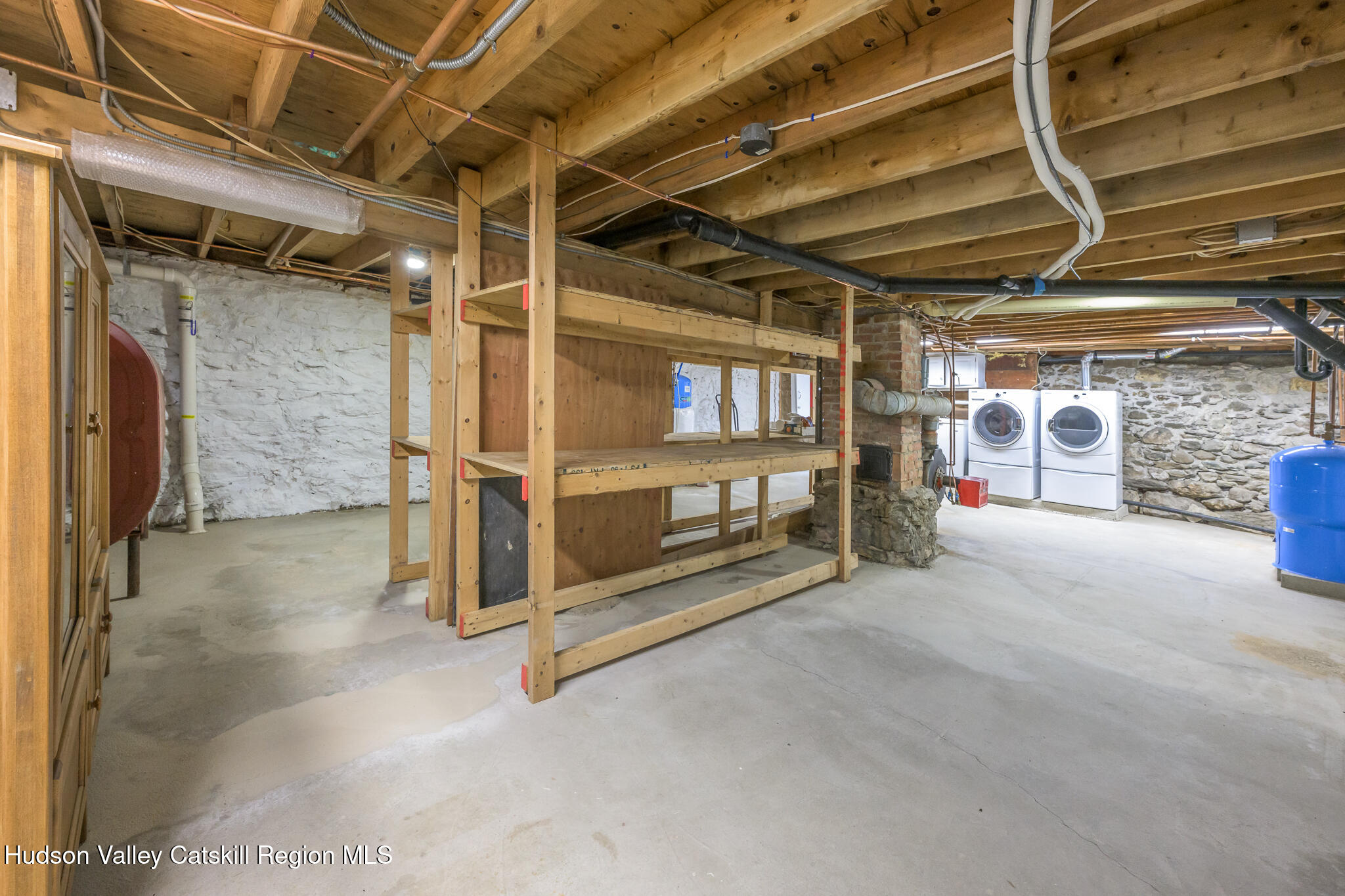 477 Fog Hill Road Austerlitz, NY 12017 - Photo 31 of 33 a view of an empty room with wooden shelves