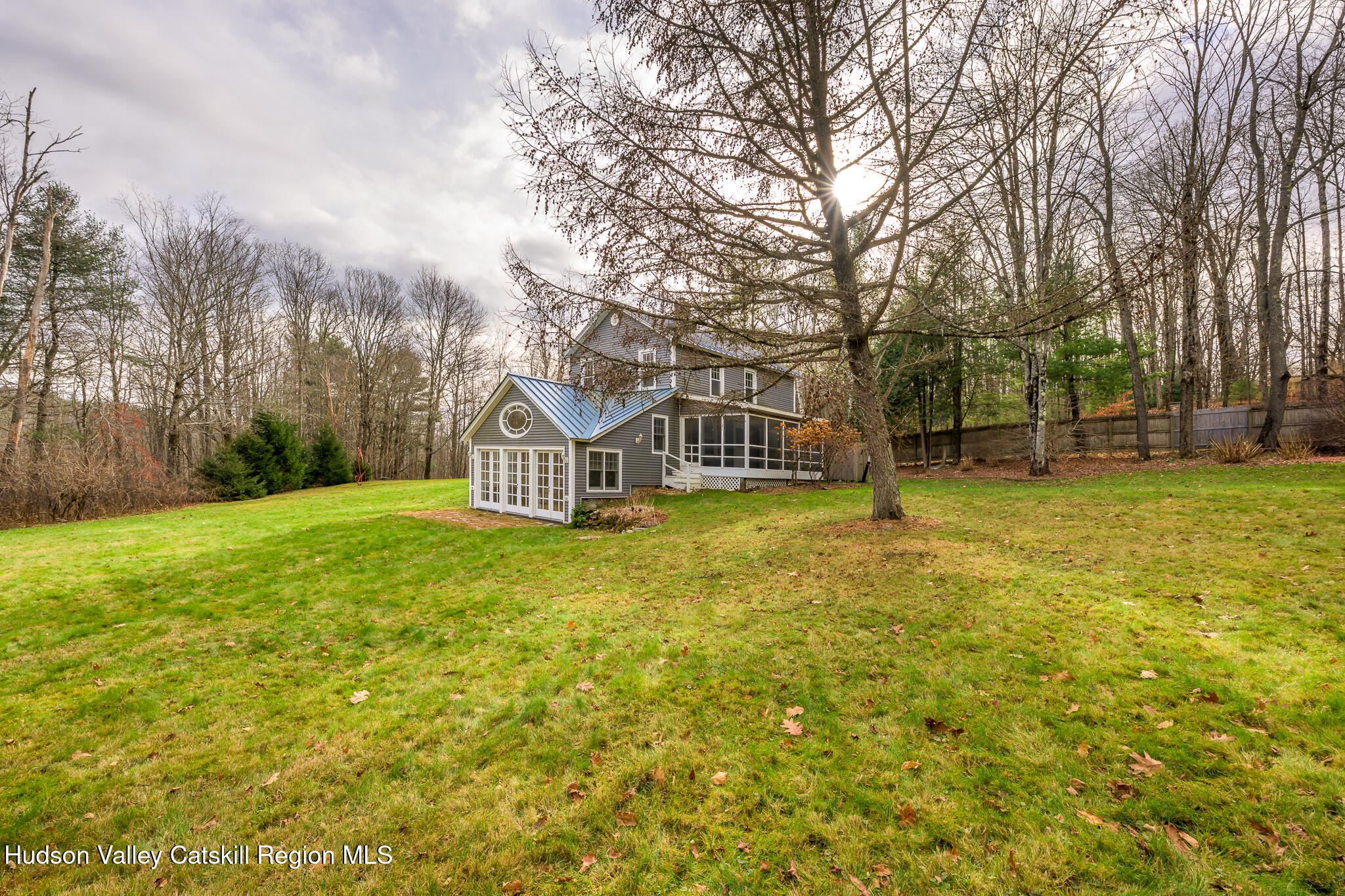 477 Fog Hill Road Austerlitz, NY 12017 - Photo 5 of 33 a blue house with a big yard and large trees
