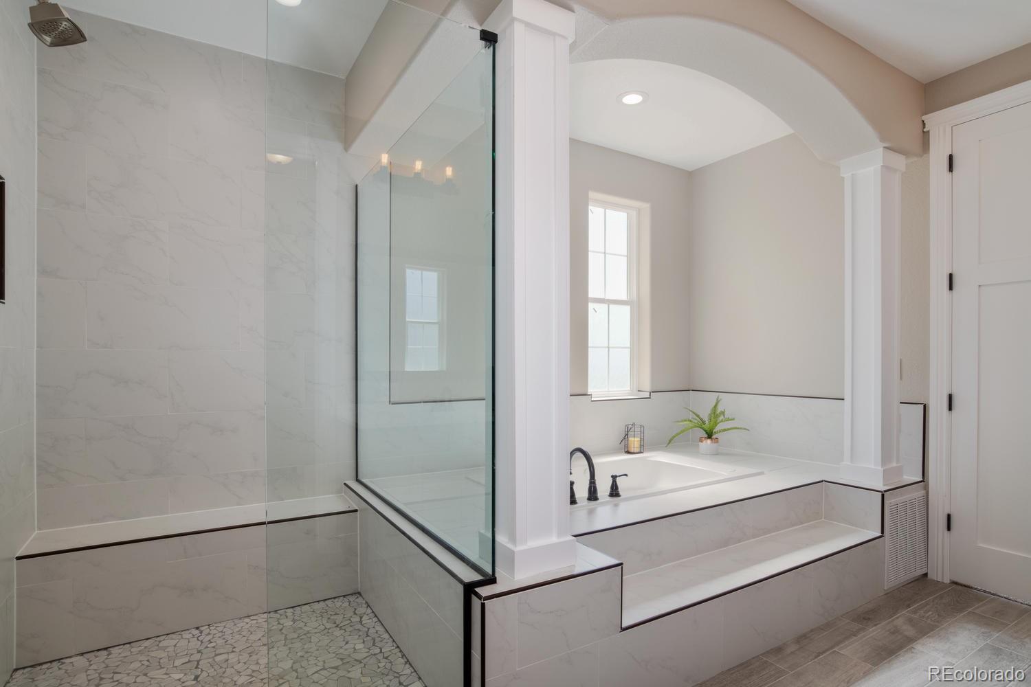 1726 Virginia Drive Fort Lupton, CO 80621 - Photo 18 of 36 a bathroom with a bathtub and a sink