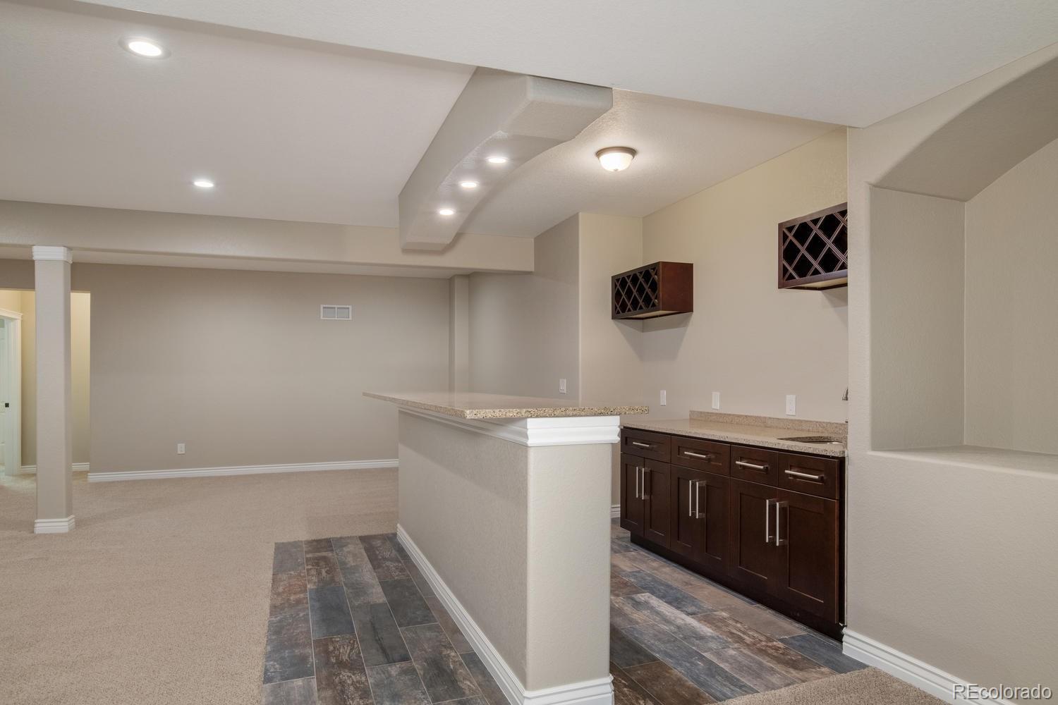 1726 Virginia Drive Fort Lupton, CO 80621 - Photo 28 of 36 a kitchen with a sink and cabinets
