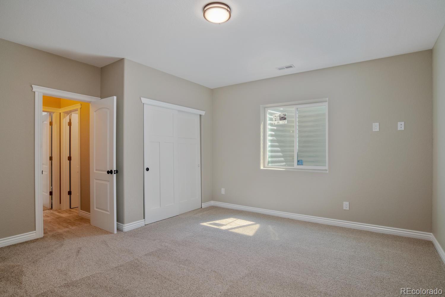 1726 Virginia Drive Fort Lupton, CO 80621 - Photo 29 of 36 a view of empty room with windows