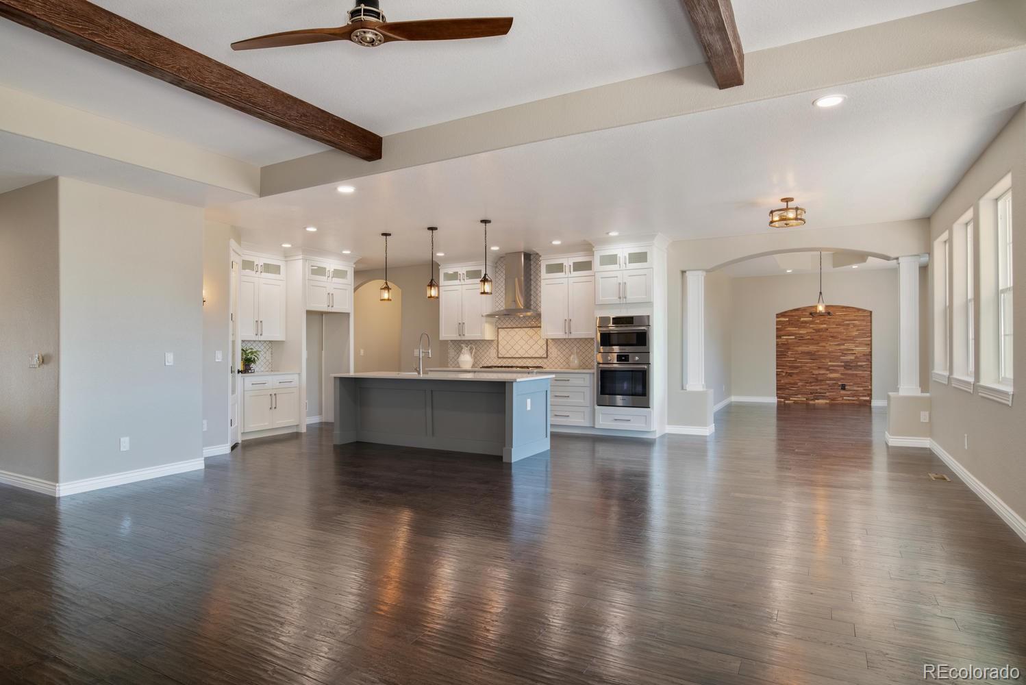 1726 Virginia Drive Fort Lupton, CO 80621 - Photo 7 of 36 a large space with kitchen view and a refrigerator