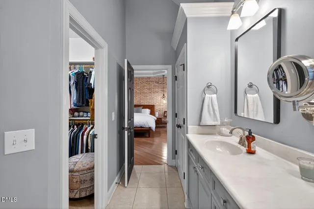 a bedroom with a bed couch and window