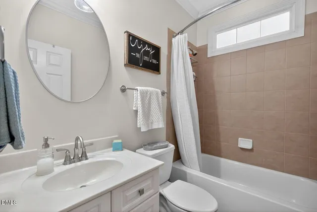 a view of a house with yard and sitting area