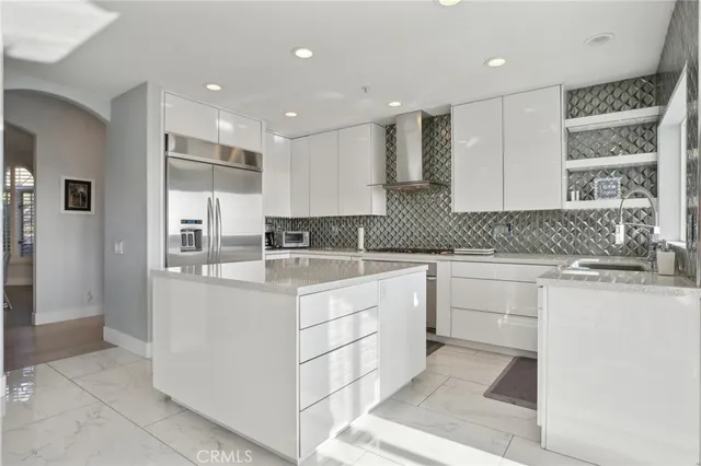 a kitchen with sink and center island