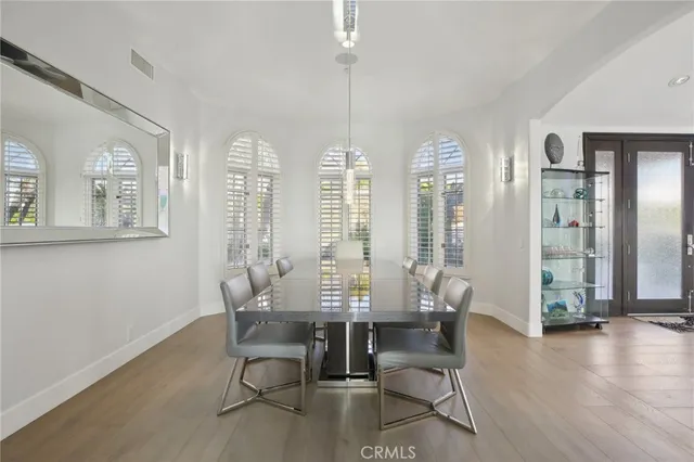 a bathroom with a granite countertop toilet sink and mirror