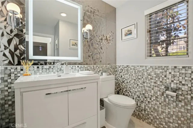 a view of a livingroom with workspace and a window