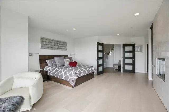 a view of a living room filled with furniture and a floor to ceiling window