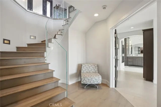 a large bed sitting in a bedroom next to a window
